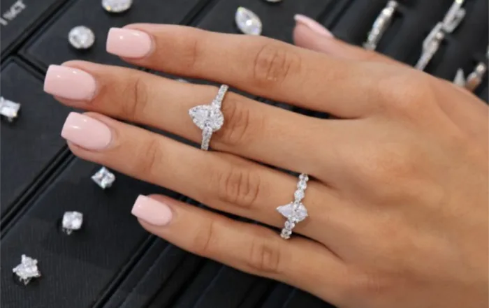 2 diamond rings on a hand
